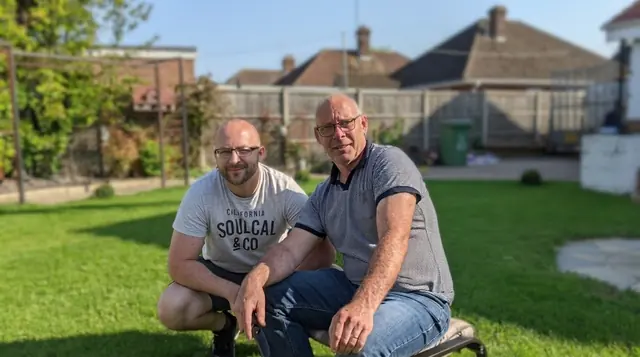 Darren and Colin today, smiling together in a sunny back garden